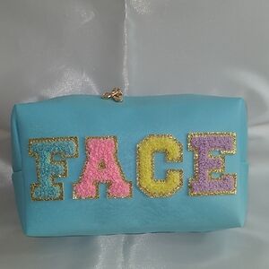 Blue FACE Clutch Bag